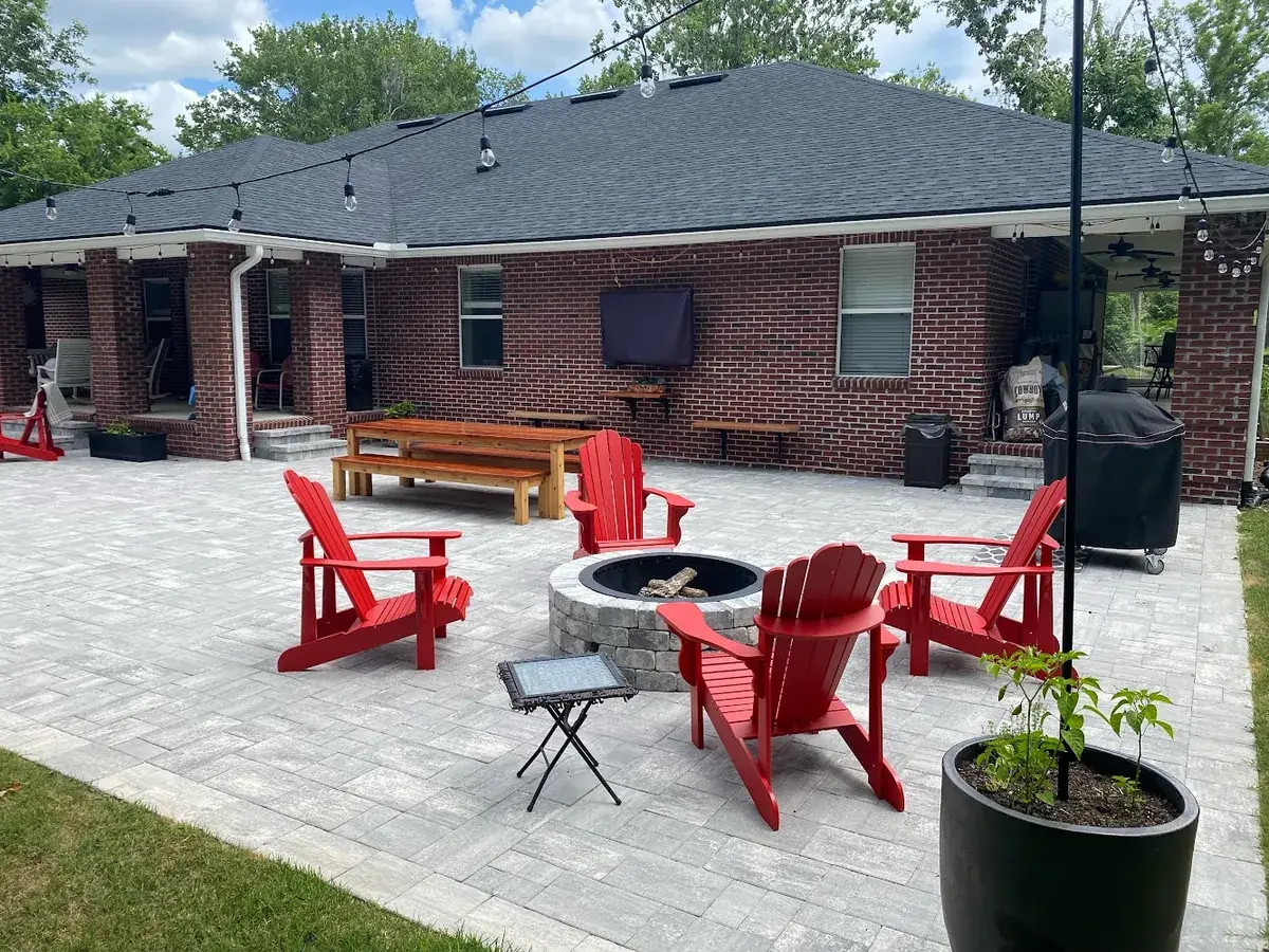 Paver patio with a fire pit and outdoor seating